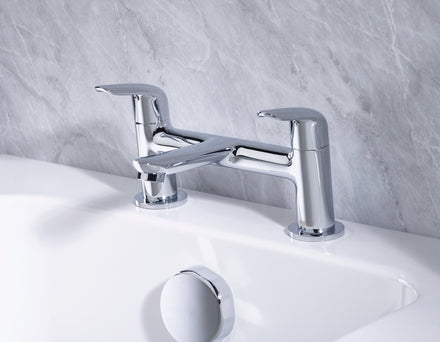 Bristan Aster Bath Filler Chrome tap on a white bath with a gray marble wall background