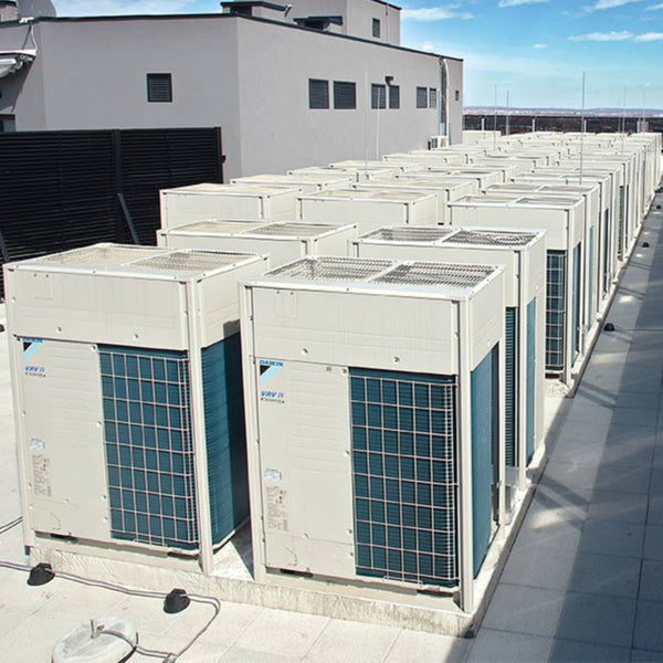 Daikin commercial heat pumps on top of roof looking out over city