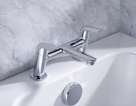 Bristan Aster Bath Filler Chrome tap on a white bath with a gray marble wall background